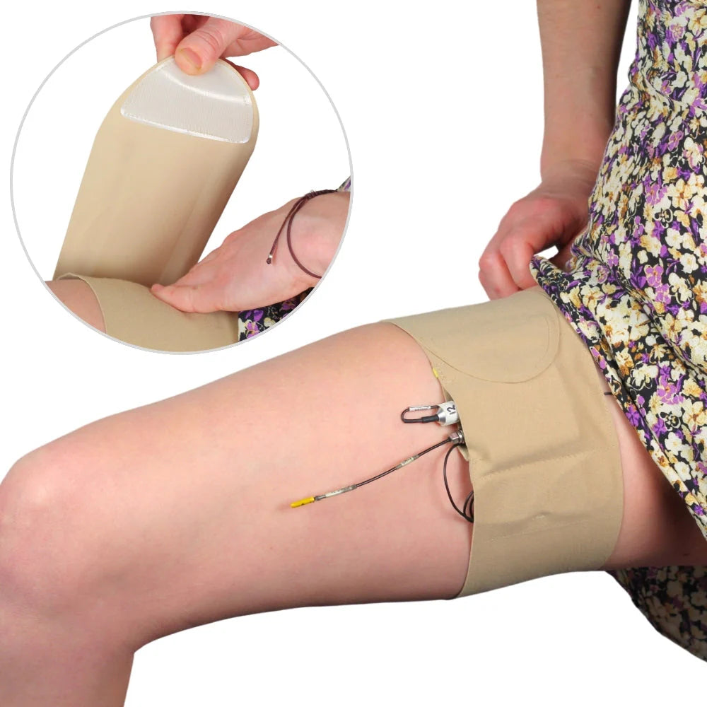 Beige thigh strap with pouch, secured with metal buckle and adjustable cords
