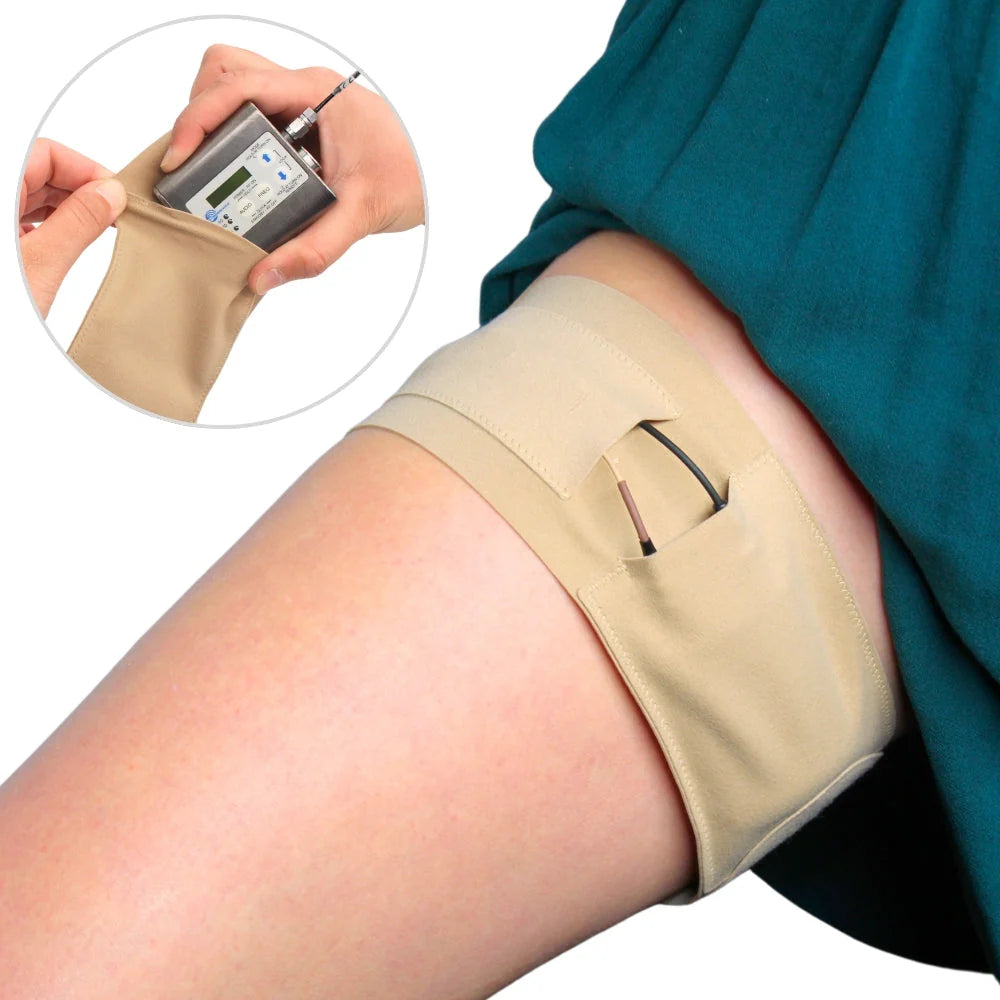 Beige thigh pouch strap worn on leg with small front pocket and adjustable placement