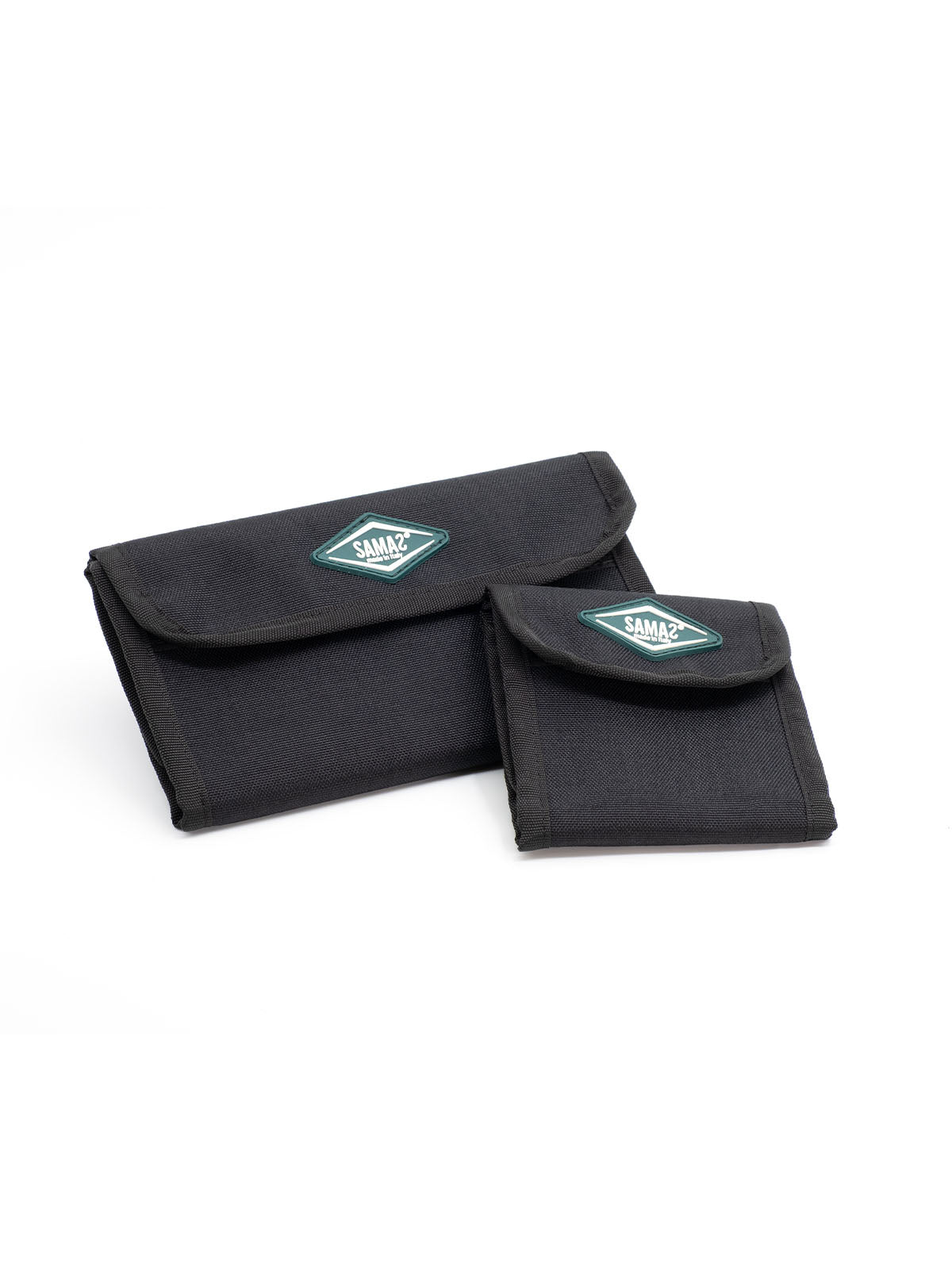 Two black cap pouches with flap closures and teal logo patches