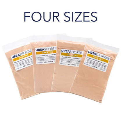 Pack of nude-tone shapewear shorts in multiple sizes, sealed plastic pouches