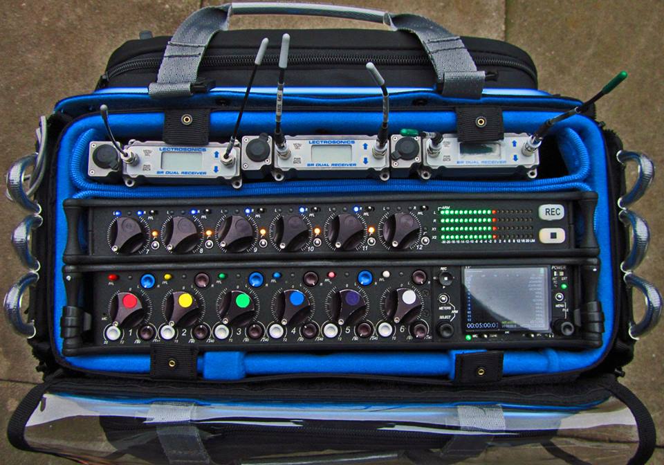 Audio mixer bag open with blue lining and front control panel insert, padded organizer