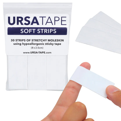 Soft moleskin hypoallergenic tape strips in light color, held for application