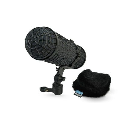 Black handheld microphone with round grille, foam windscreen, and mount handle kit