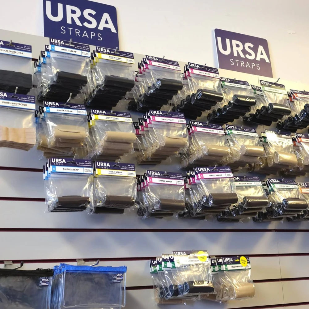 URSA Straps wall display of waist straps with single pouches in beige and black