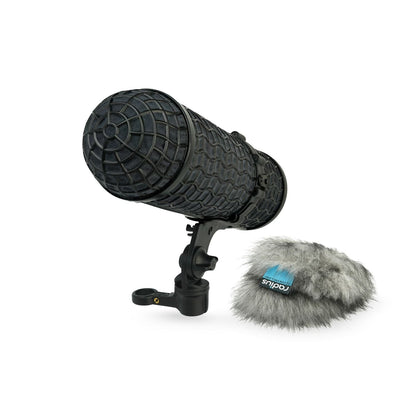 Black handheld microphone with round grille, gray furry windscreen, and mount handle