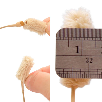 Beige plush fur microphone sleeve with size check against a measuring ruler