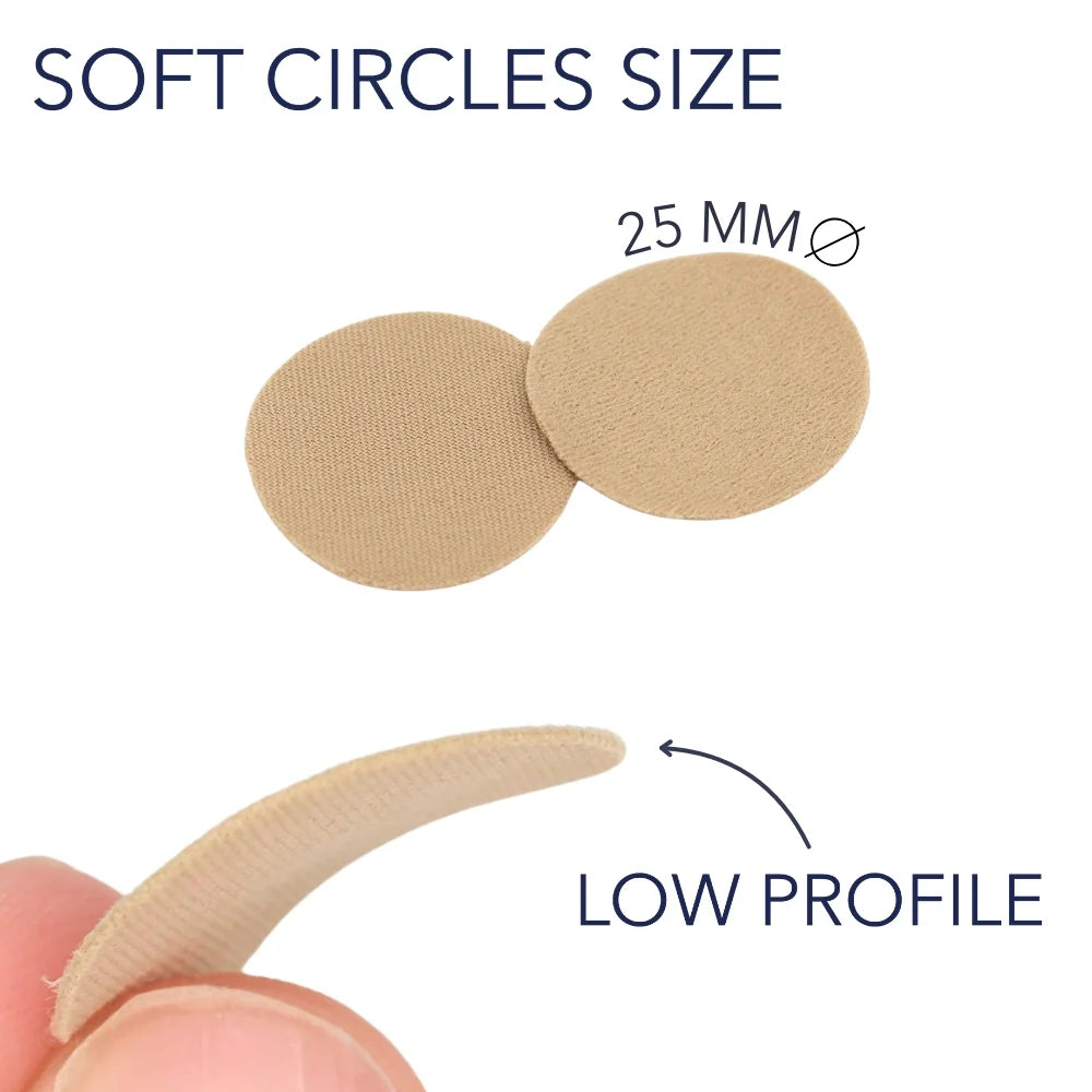 Two beige fabric adhesive circles on sticks, low-profile oval shape