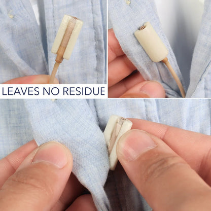 Cream tape strip applied to light-blue fabric, hands pressing edges