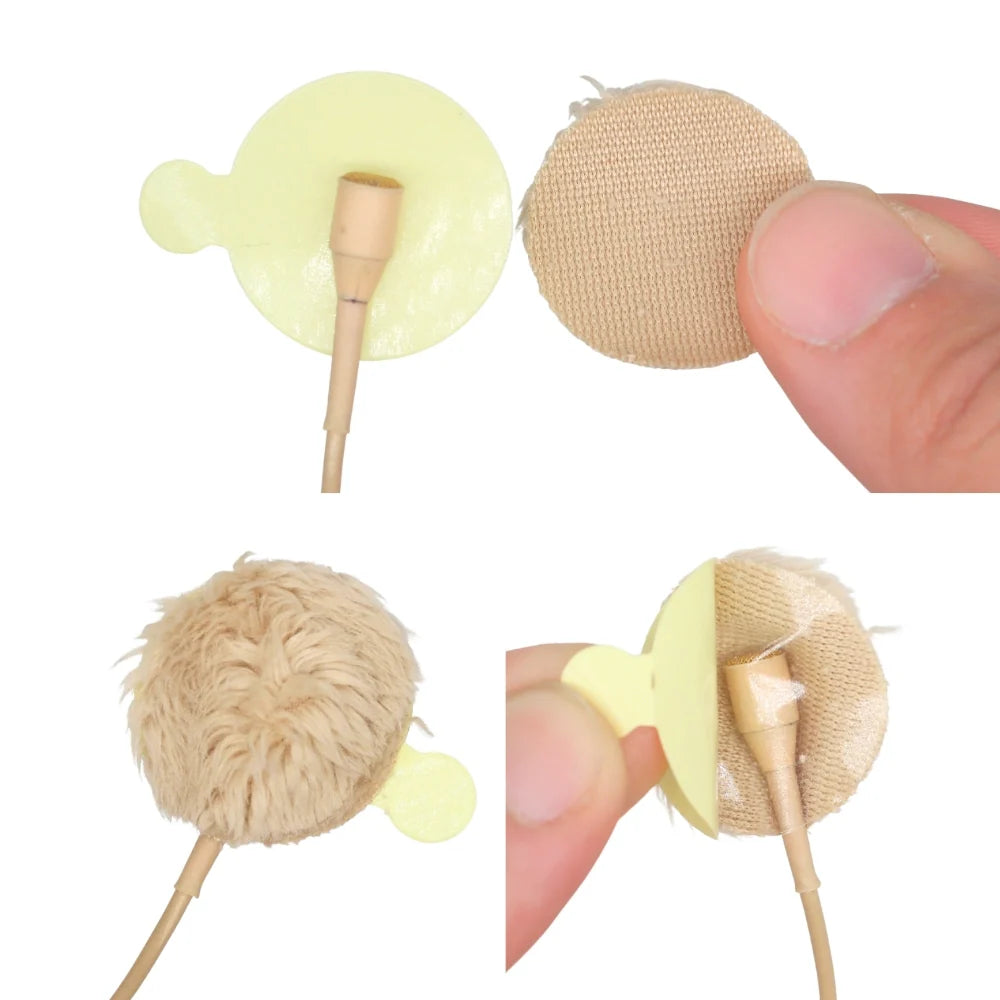 Beige plush circle short-fur wind protectors on sticks, held in hand