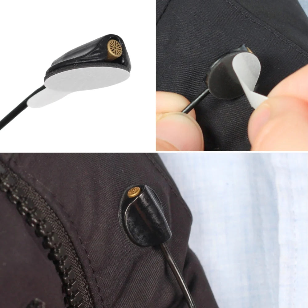 Round sticky adhesive pads on dark jacket and pants near a button and zipper