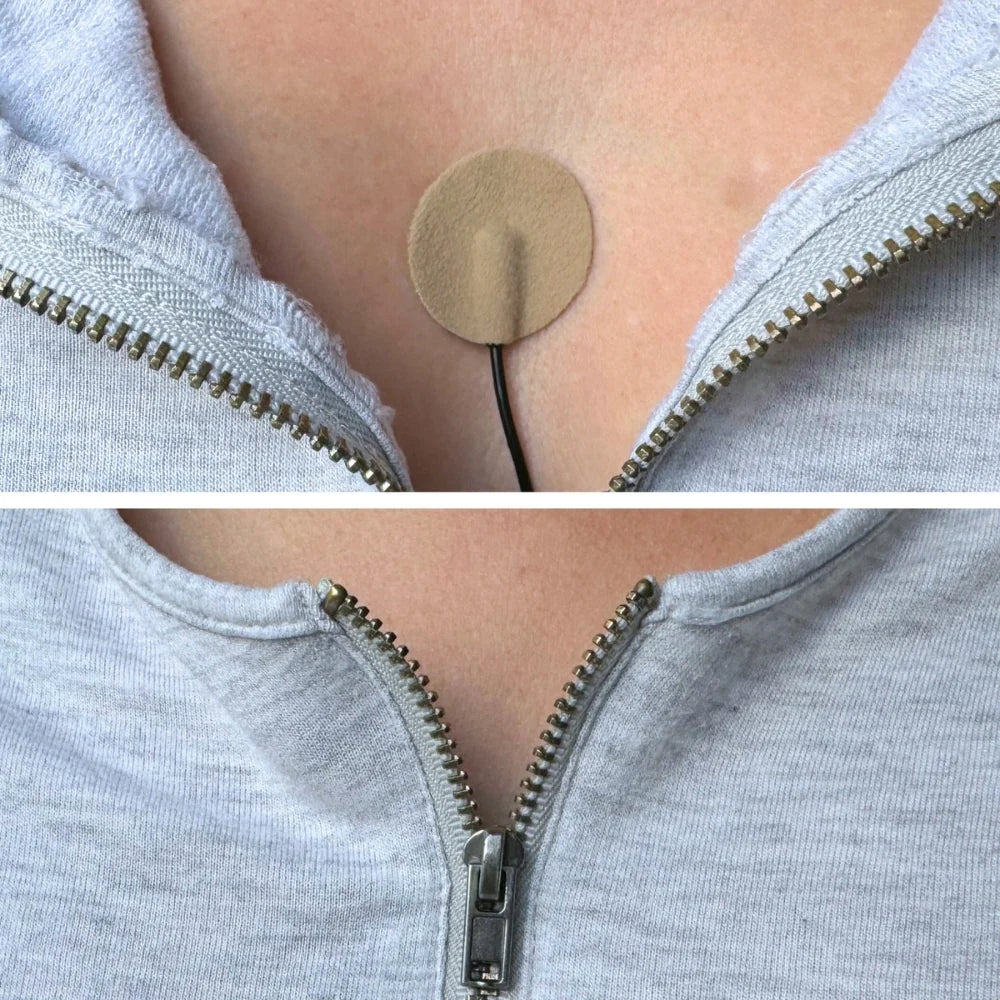 Beige fabric adhesive circle on a stick on a light gray-blue hoodie neckline