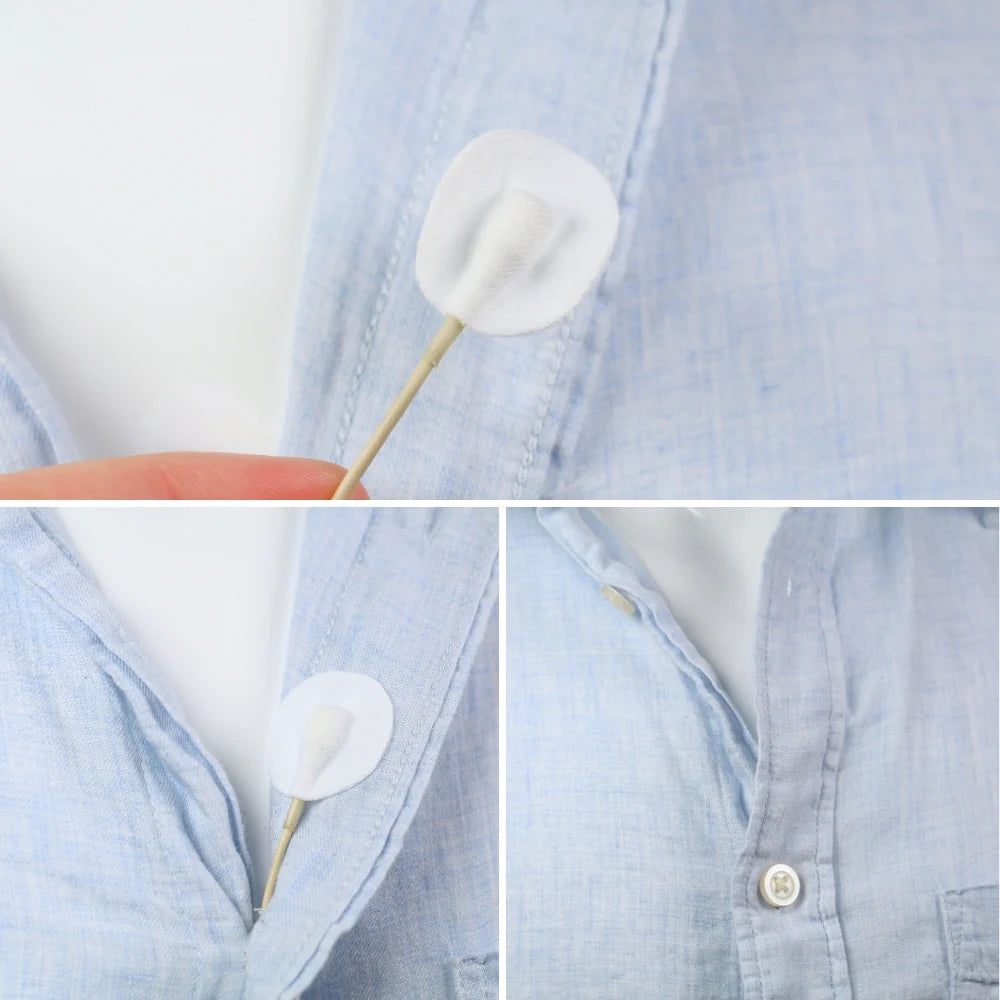 Round fabric adhesive circle on a stick attached to light blue shirt fabric
