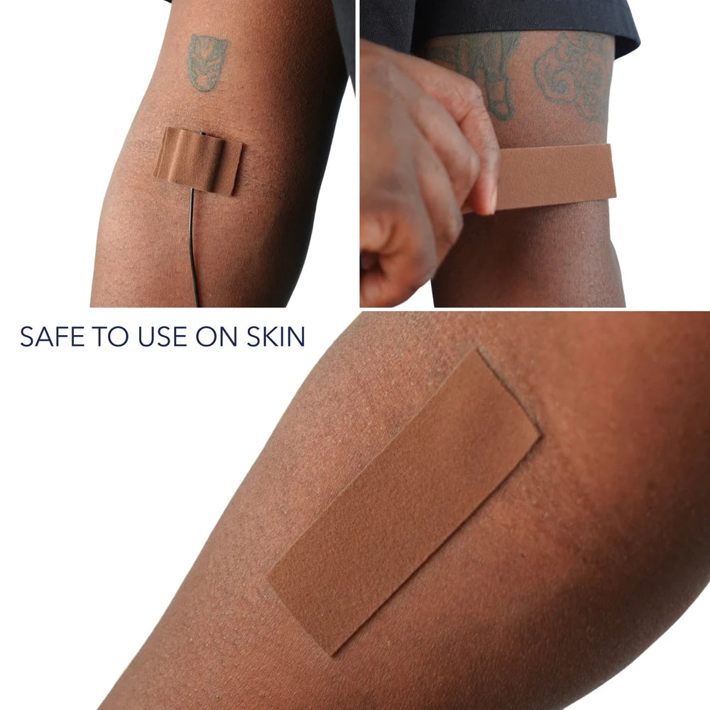 Soft moleskin tape strips applied to skin for secure placement