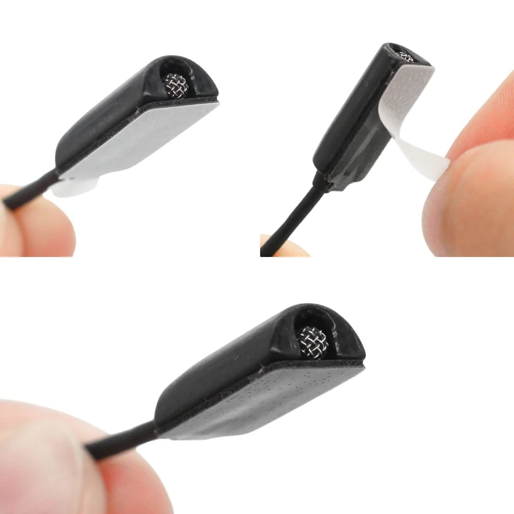 Adhesive mini mount stickies with black peel tabs, held up for detail