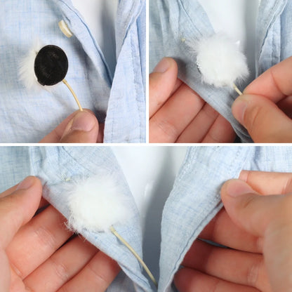 Black fur circle wind cover attached to a light blue fabric with a stick backing