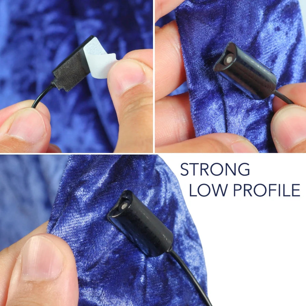 Black mini mount pad secured on dark blue fabric, hands adjusting placement