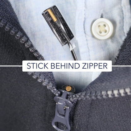 Cream adhesive tape used to secure fabric behind a zipper