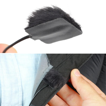 Black sticky square pad pressed onto fabric with raised edge for removal