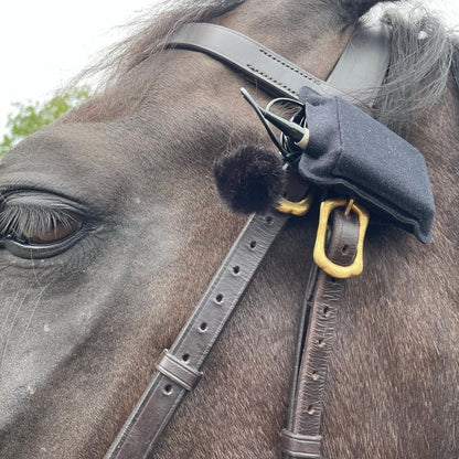 Belt pouch on a horse tack strap—leather pouch attachment with metal clasp