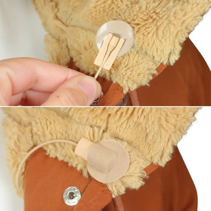 Beige fabric adhesive circle on a stick attached to a tan, fuzzy jacket