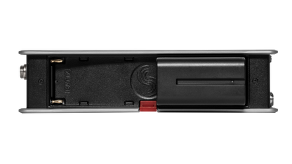 Black audio recorder rear panel with port cover and red latch