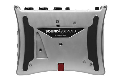 Silver audio recorder rear panel with SOUND DEVICES logo and red latch
