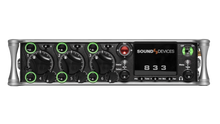 Black audio recorder front panel with knobs, meters, and green-ring controls