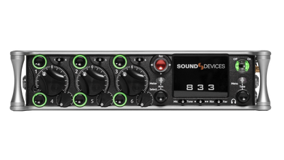Black audio recorder front panel with knobs, meters, and green-ring controls