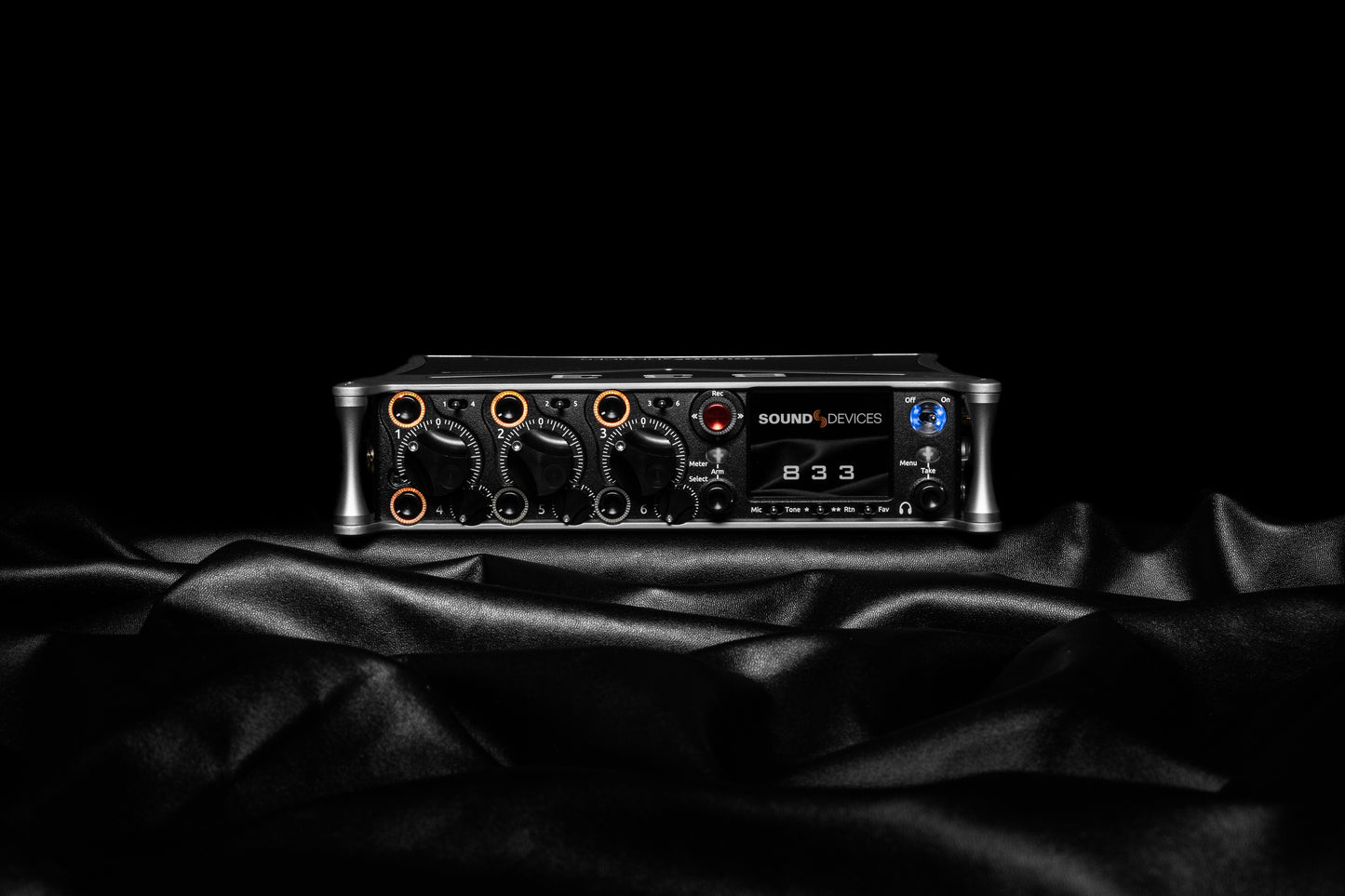 Black audio recorder unit with front control knobs and display