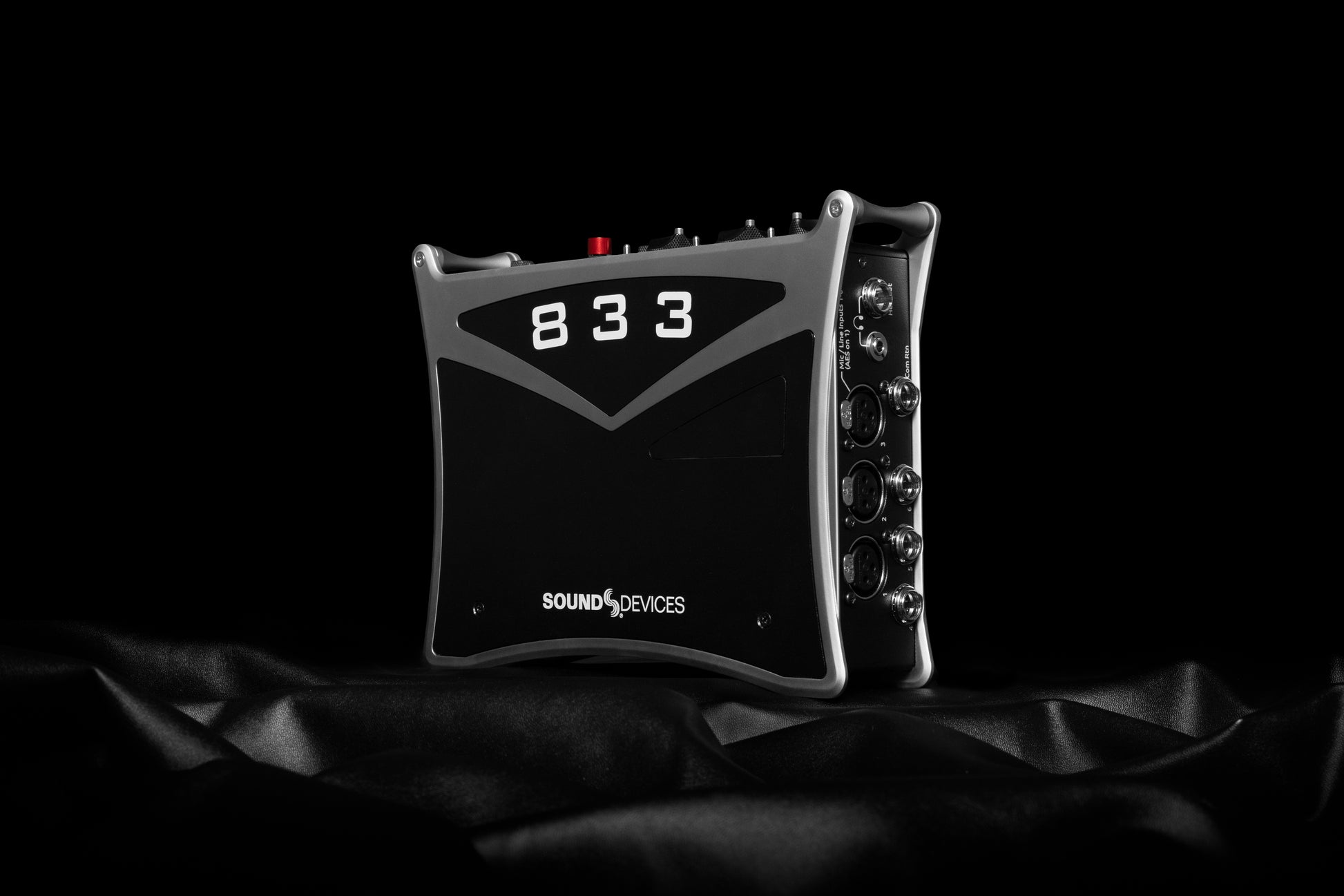 Black audio recorder front corner view with 833 label and side controls