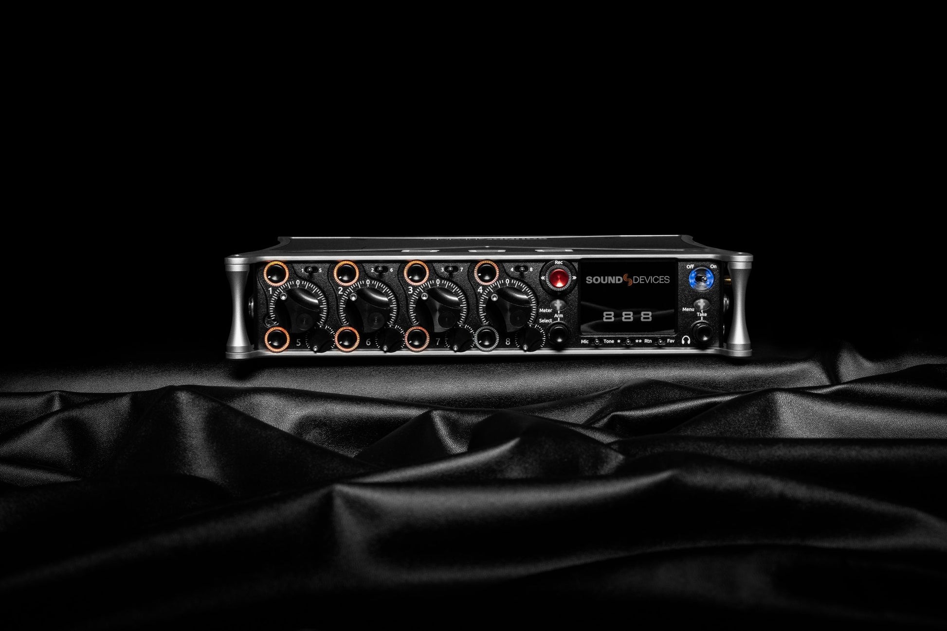 Sound Devices 888 audio mixer/recorder front view on dark backdrop with “SOUND DEVICES” logo