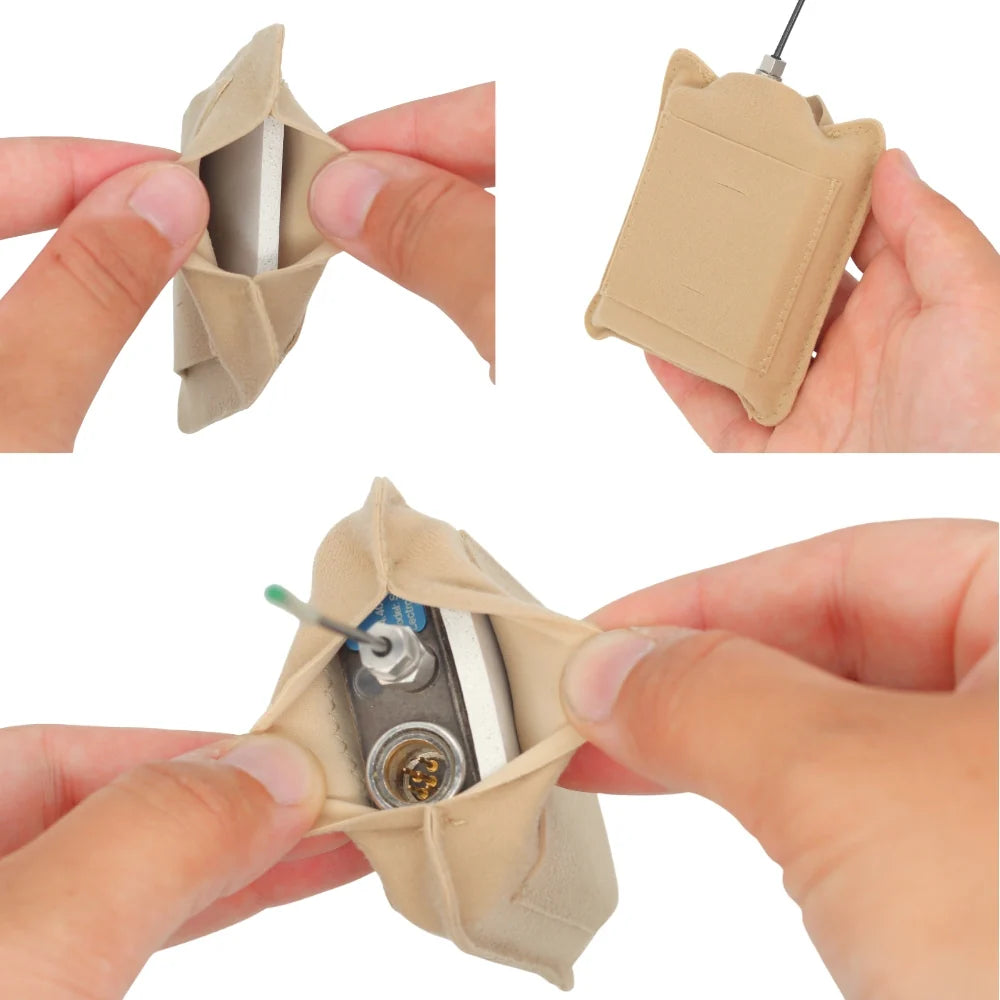 Heat shield cover held open by hands, showing inner pouch lining and mounting area