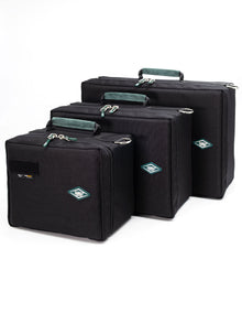 Black accessory organizer case set with teal-lined compartments and top handle.