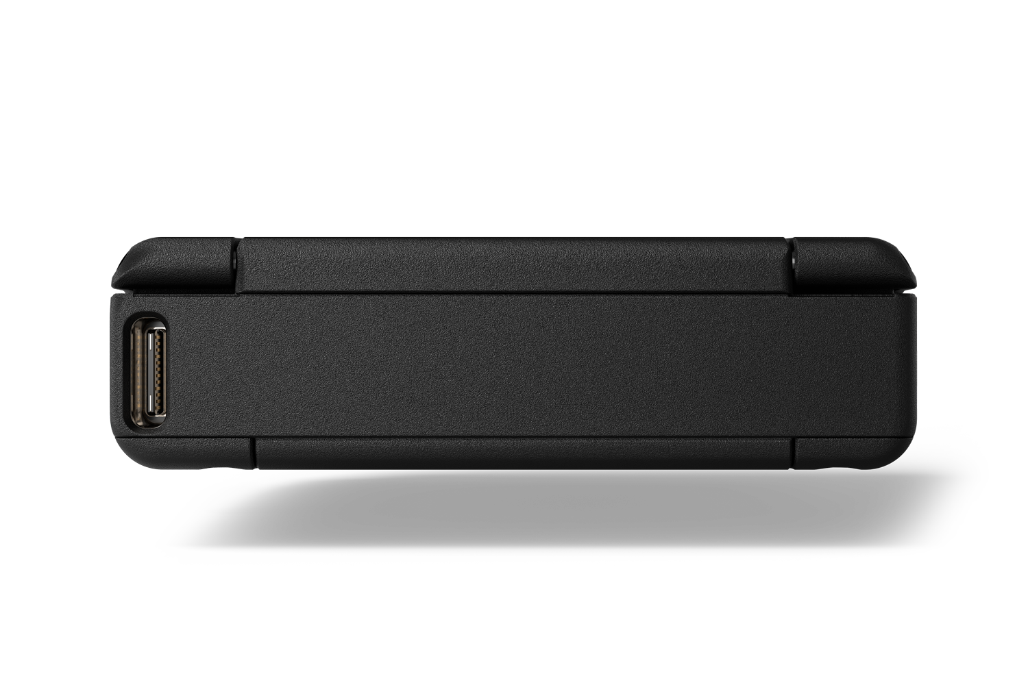 Portable audio device side with connector port openings and slim matte dark housing