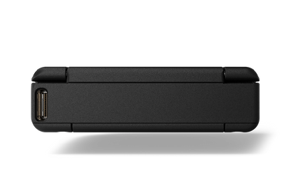 Portable audio device side with connector port openings and slim matte dark housing