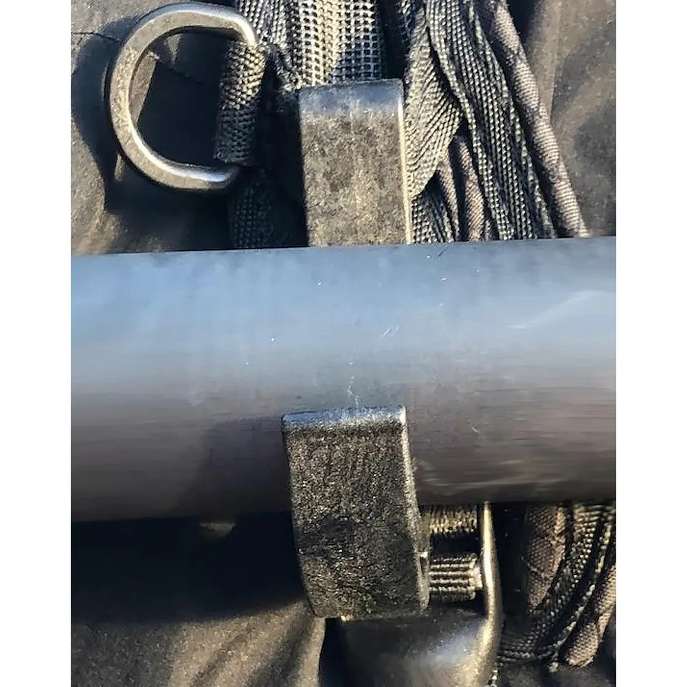 Heavy-duty hook and strap clamp gripping a metal bar