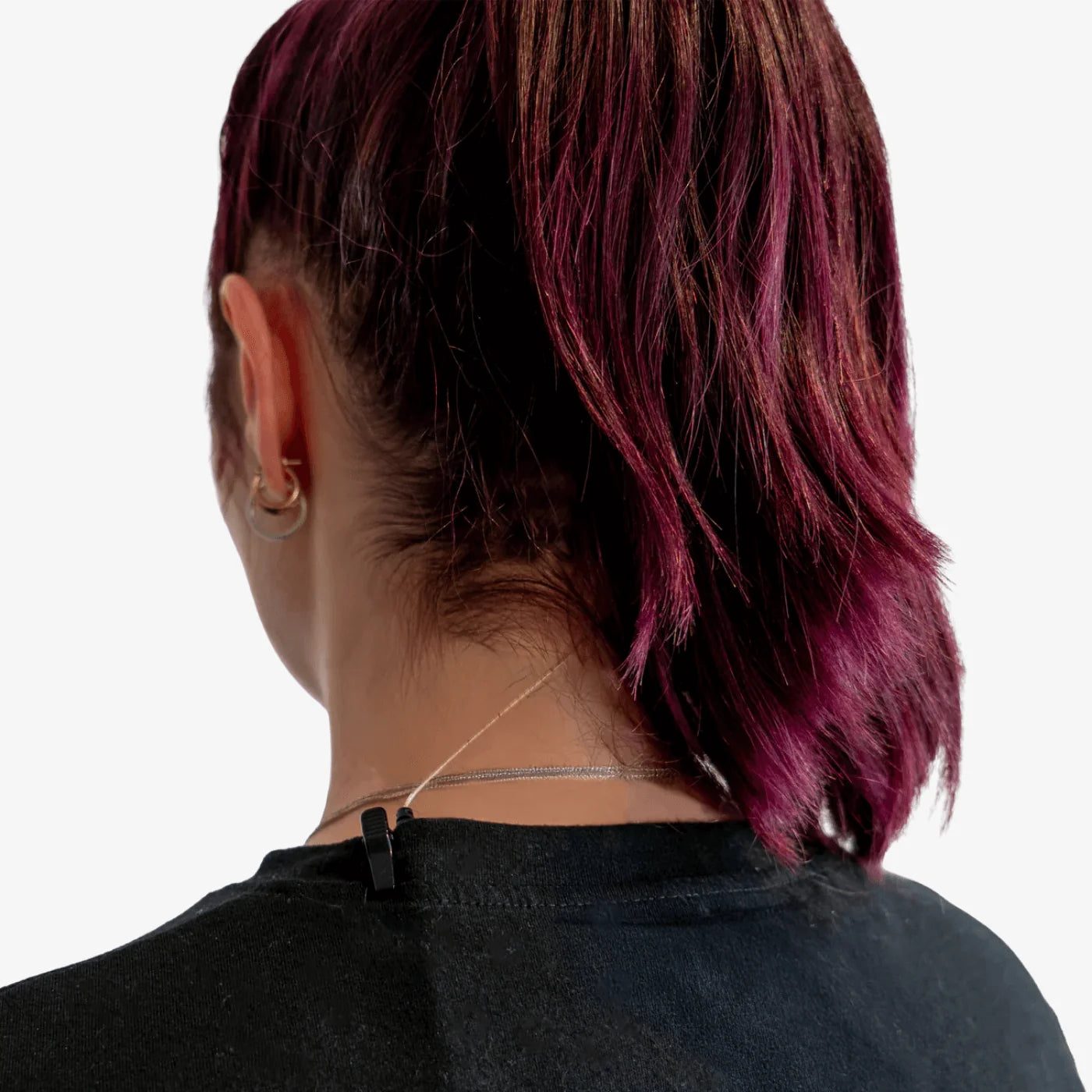 Black IEM cable clip fastened to a shirt collar with cable run