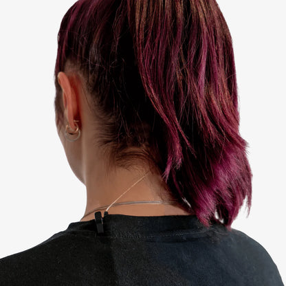 Black IEM cable clip fastened to a shirt collar with cable run