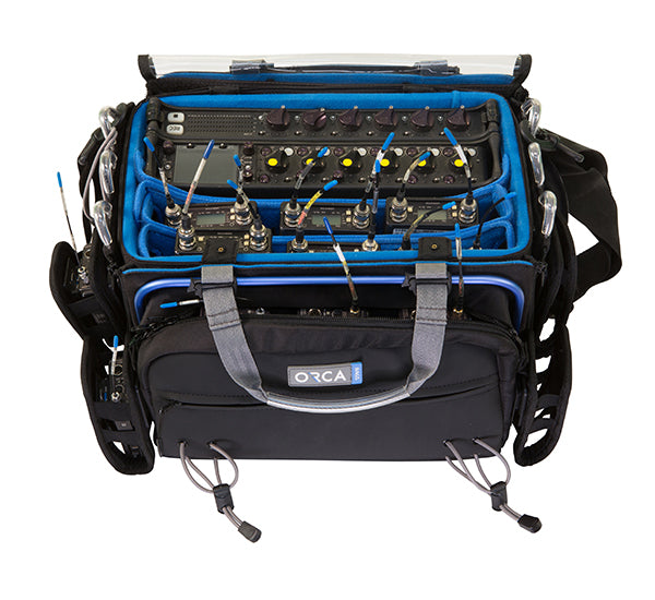 Audio mixer bag with blue padded interior and black exterior, open view showing compartments