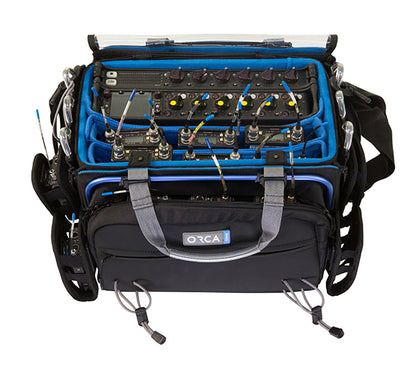 Audio mixer bag with blue padded interior and black exterior, open view showing compartments