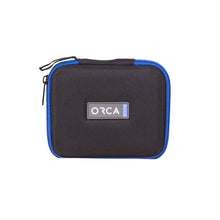 Dark gray capsule audio pouch with blue trim, zipper, ORCA logo patch