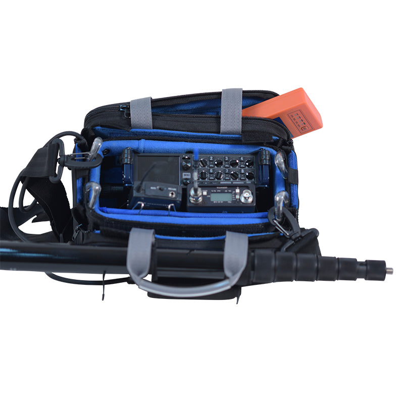 Small audio mixer bag with open organizer, mixer board, blue lining, and black protective pads.