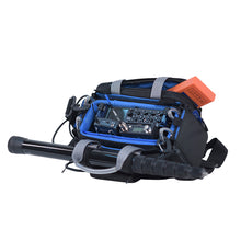 Small audio mixer case bag front view, blue interior lining, black shell, and orange accessory tag.