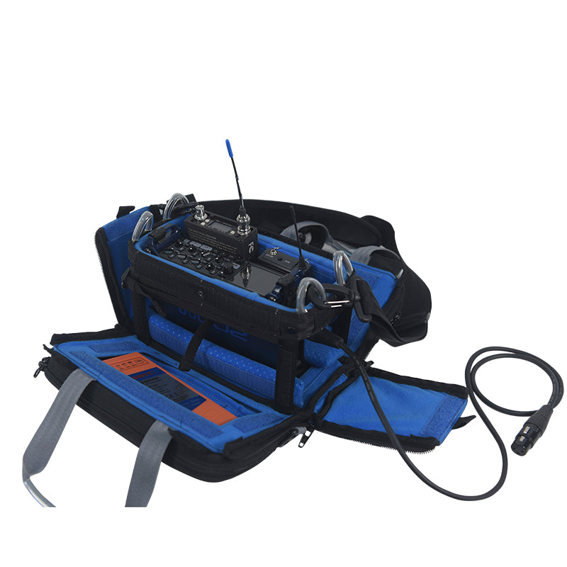 Audio mixer bag with mixer installed, blue padded base, and attached power cable
