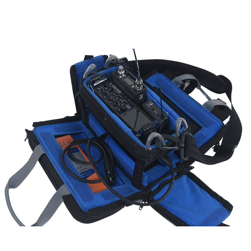 Audio mixer bag with blue interior and molded mount holding a mixing console
