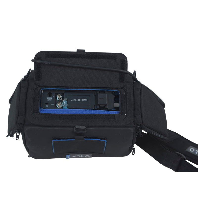 Audio mixer bag open with device window, blue trim accents, and crossbody strap
