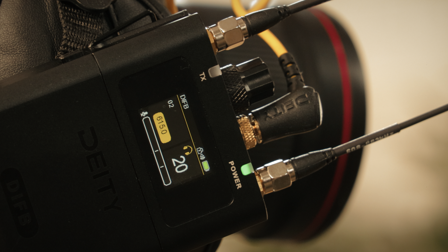 Close-up of DEITY receiver controls and LCD showing channel and signal levels