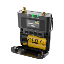 Black DEITY wireless transmitter kit on base with LCD screen and ports