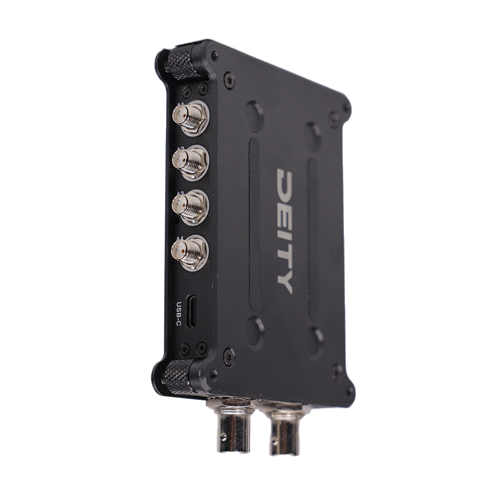 Black RF signal distributor with USB-C port and BNC connectors on side