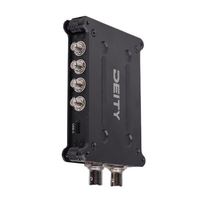 Black RF signal distributor with USB-C port and BNC connectors on side